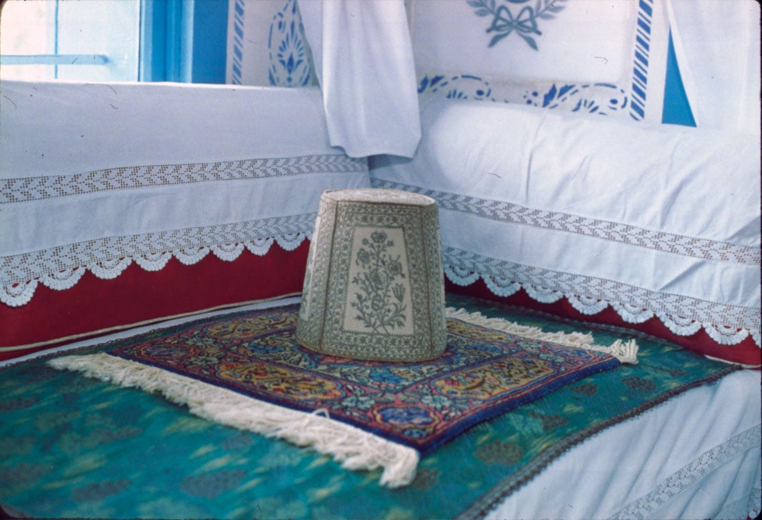 Bahá'u'lláh's taj marks the spot where He sat when receiving guests in His room at Bahji.